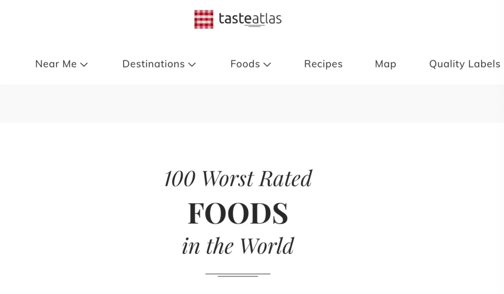 TasteAtlas网站的页面截图，标题为“100 Worst Rated Foods in the World”，展示全球最差评价的100款食物。