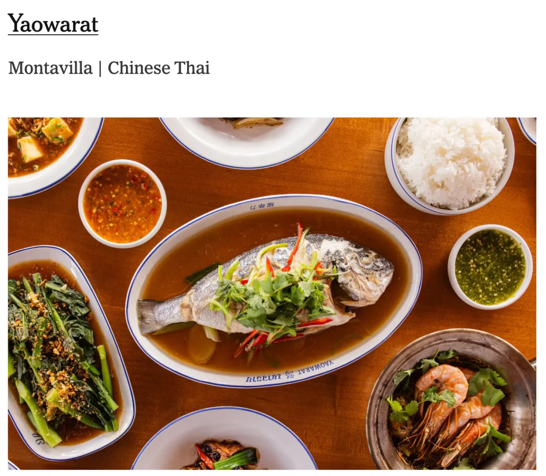 Montavilla街区Yaowarat餐厅内，一桌中泰融合美食：清蒸鱼配香菜葱丝、炒青菜撒蒜末、白米饭配红绿蘸料，还有红棕汤汁豆腐及鲜嫩虾品，色彩丰富，展现夜市风味与中式烟火气的碰撞。
